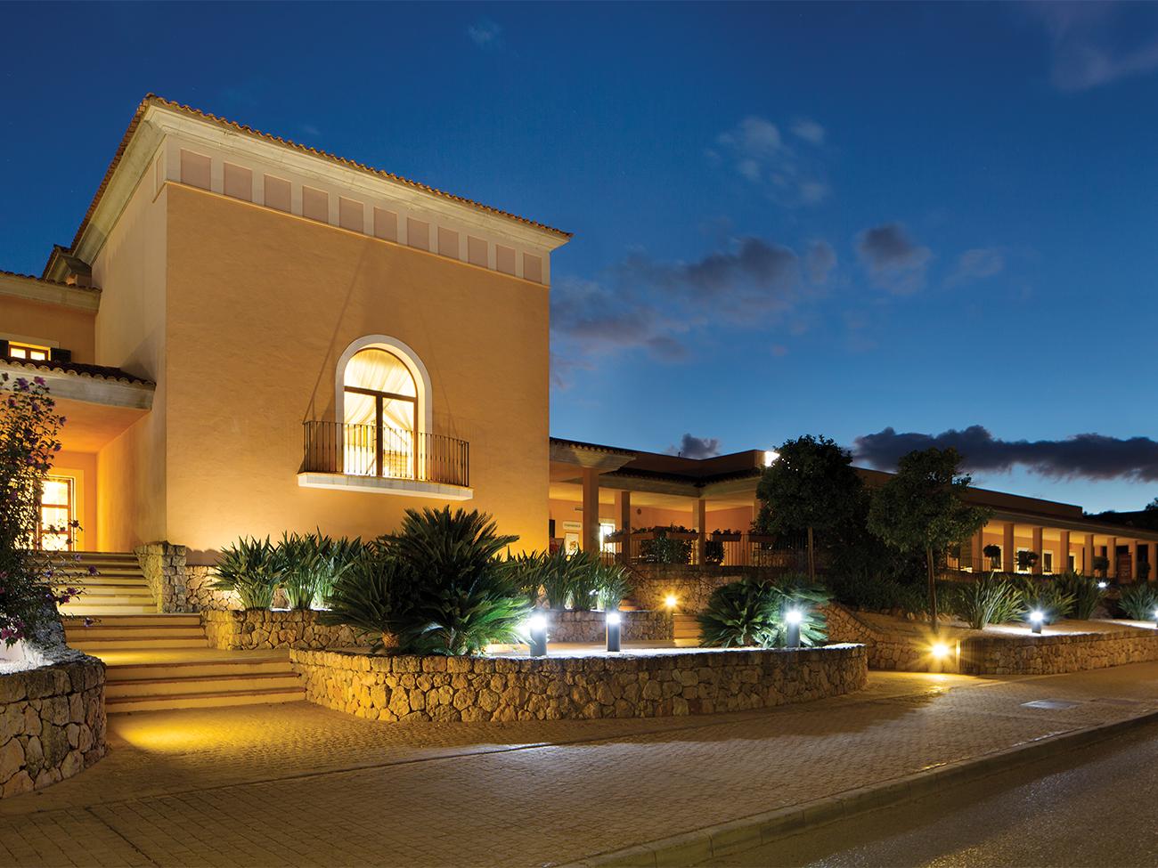 Exterior of main entrance at dusk of Marriott's Club Son Antem resort timeshare